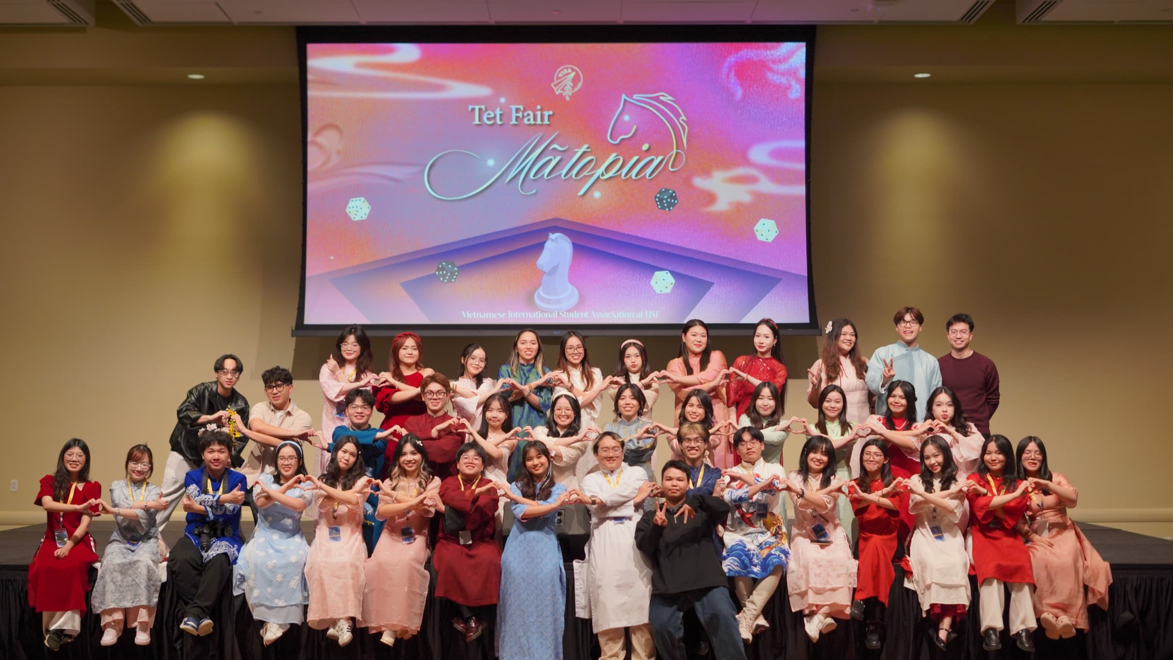 VISA at USF members gathered on stage at a chapter event
